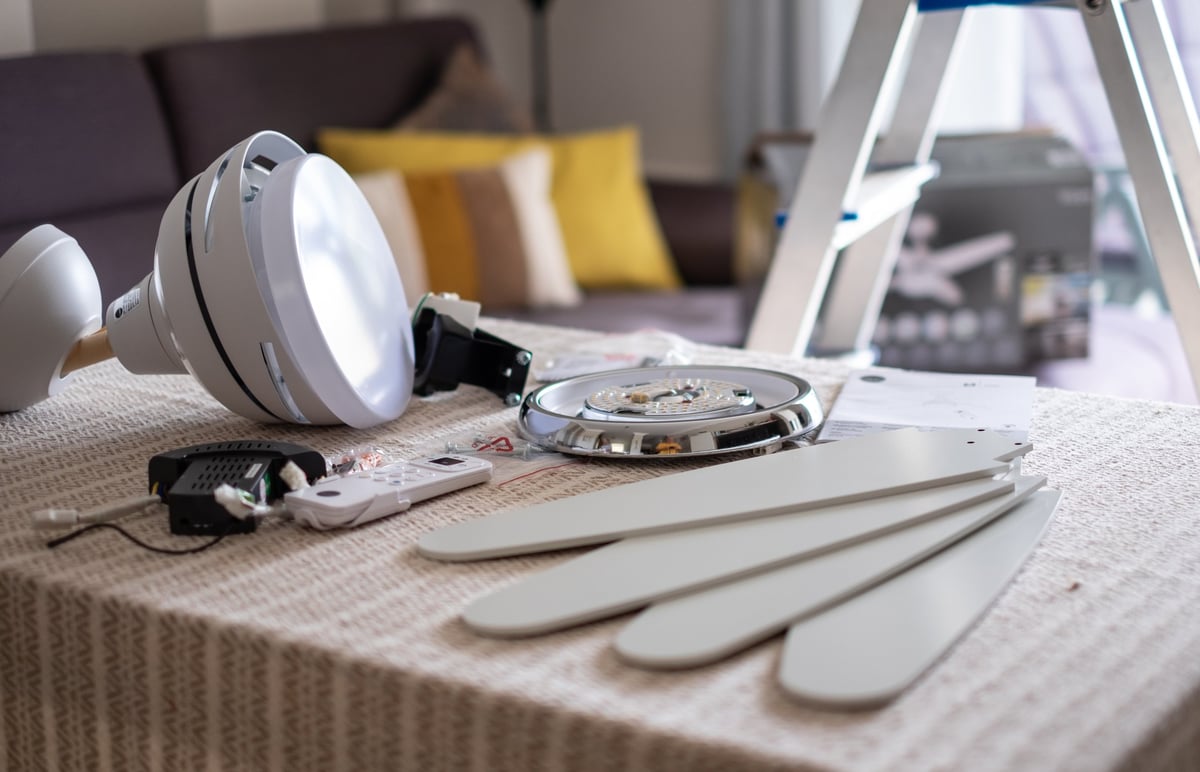 Ceiling fan components laid out ready to be assembled for installation